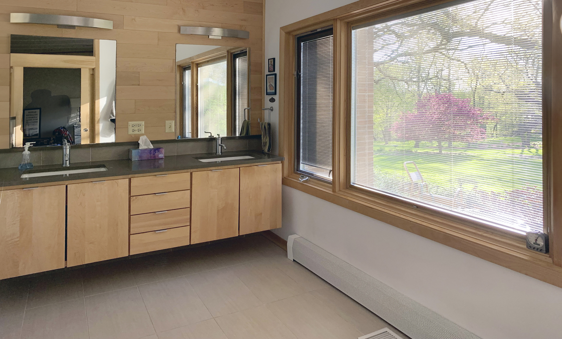 38W481 Silver Glen Road St. Charles, IL 60175 - Photo 7 of 21 a bathroom with a sink and a large mirror next to a window