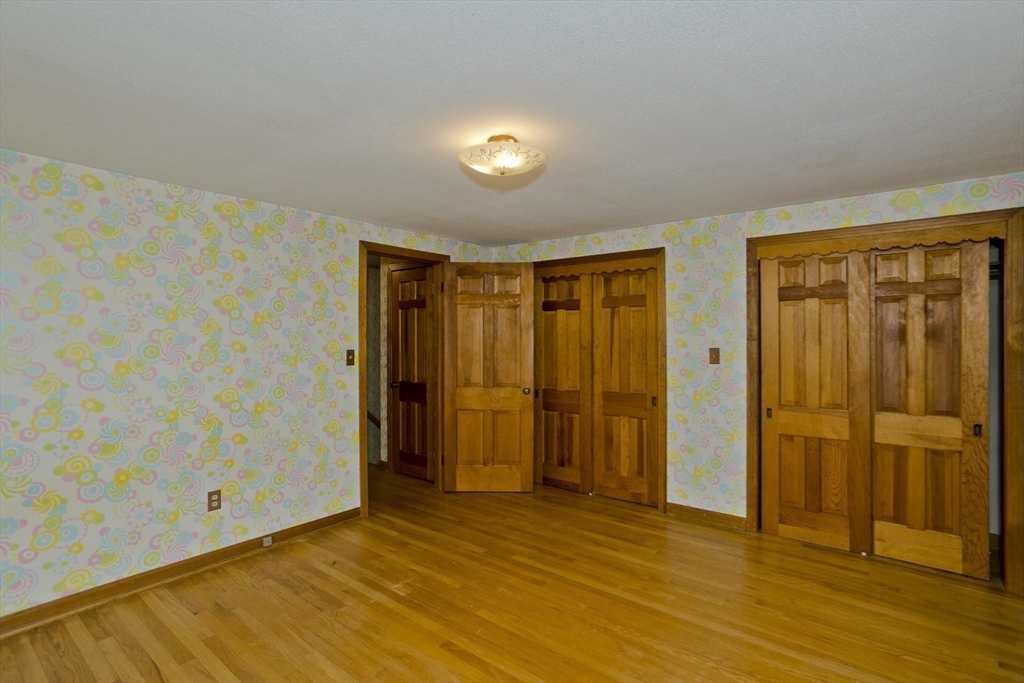102 West Meadowview Road Holyoke, MA 01040 - Photo 13 of 39 a view of an empty room with wooden floor and a window
