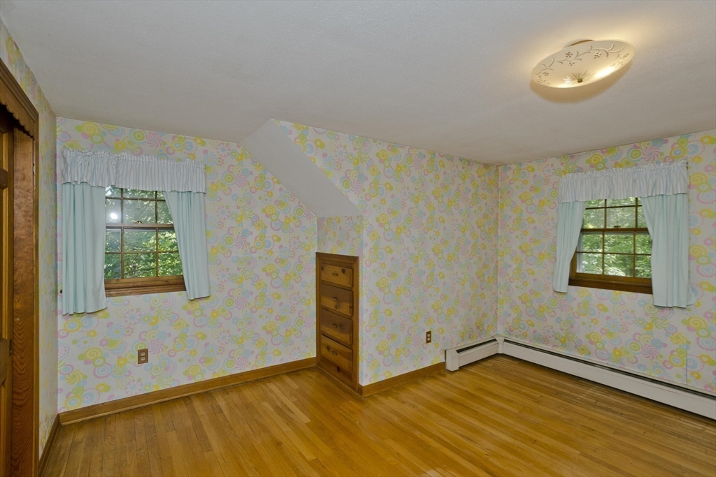 102 West Meadowview Road Holyoke, MA 01040 - Photo 14 of 39 a view of an empty room with wooden floor and a window