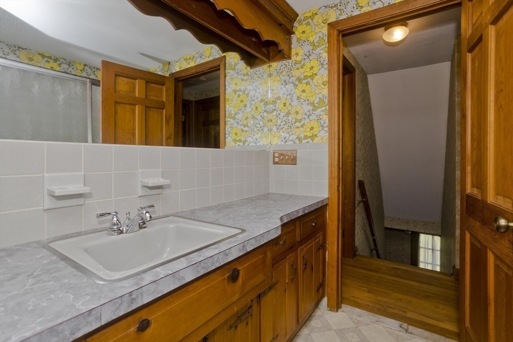 102 West Meadowview Road Holyoke, MA 01040 - Photo 20 of 39 a bathroom with a sink and a mirror