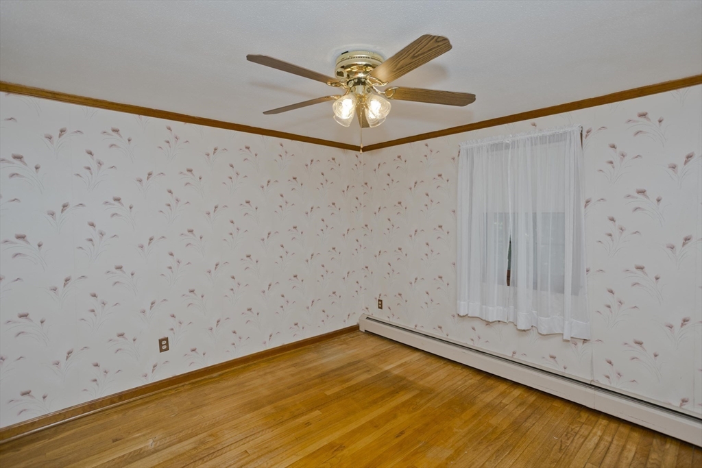 102 West Meadowview Road Holyoke, MA 01040 - Photo 26 of 39 a view of a room with a ceiling fan and wooden floor
