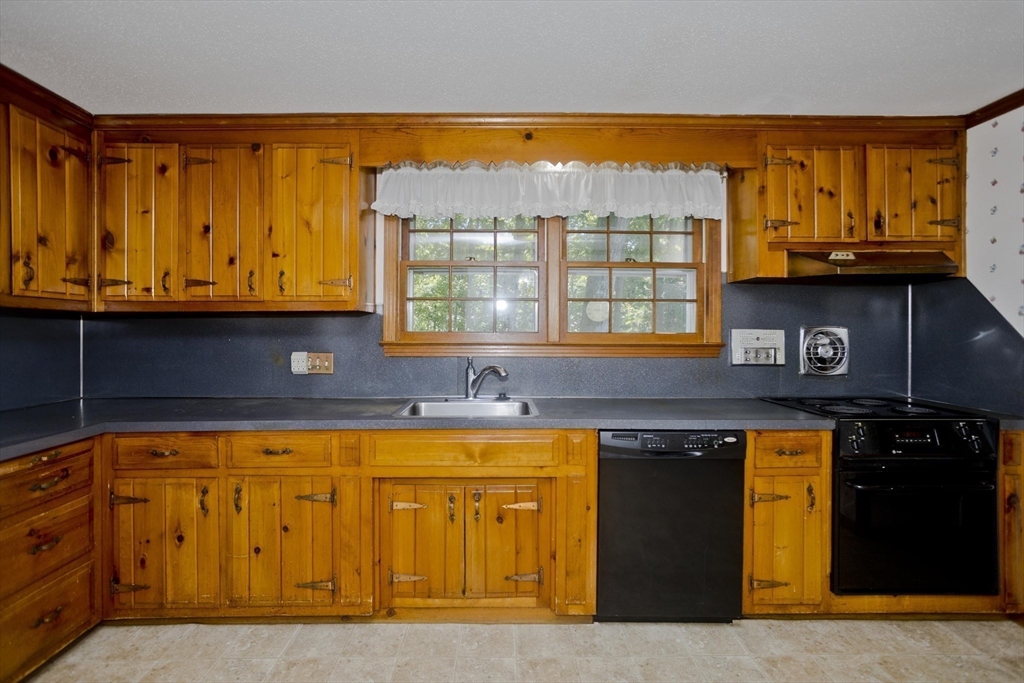 102 West Meadowview Road Holyoke, MA 01040 - Photo 9 of 39 a view of a kitchen with a sink and a window