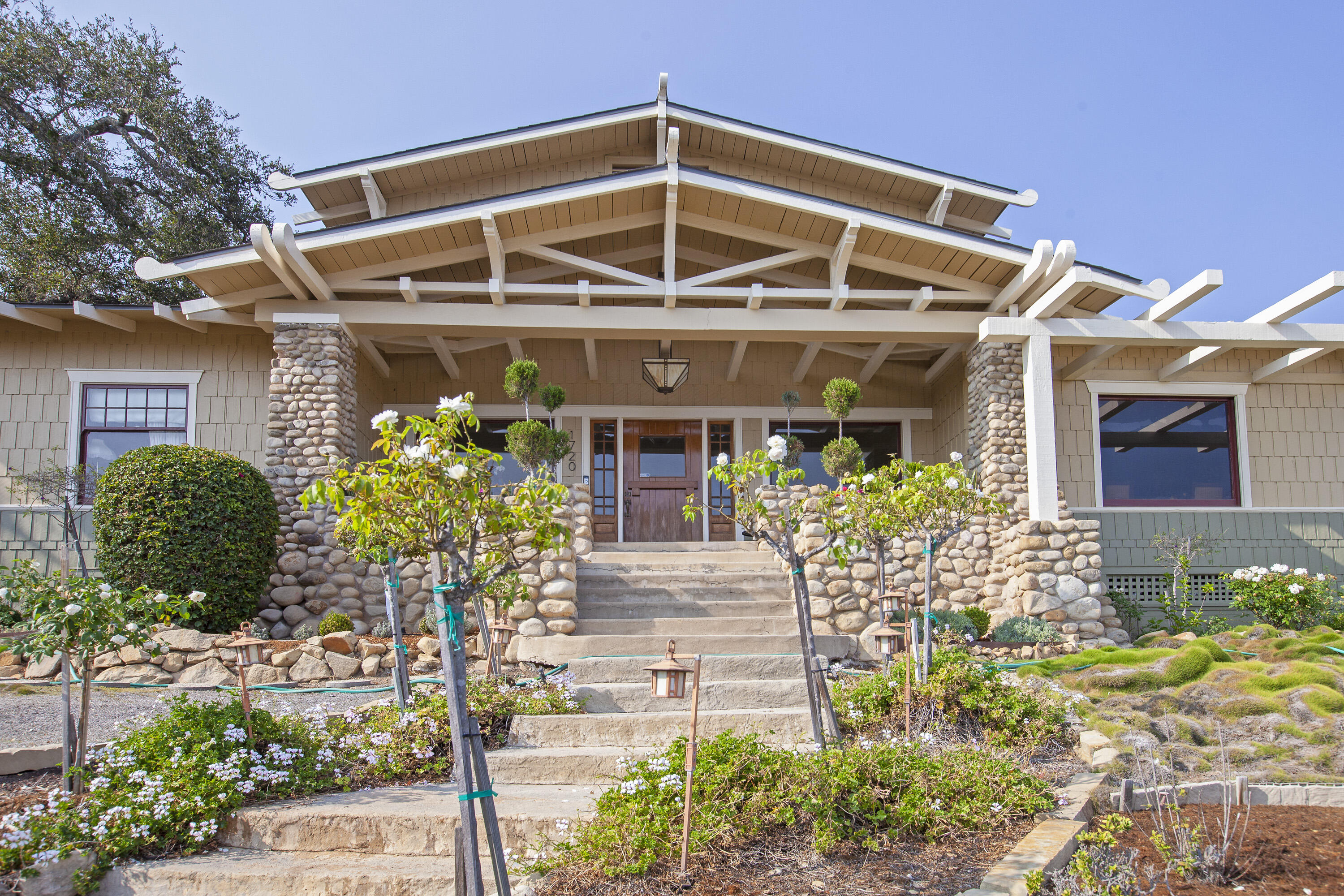 1720 Lasuen Road Santa Barbara, CA 93103 - Photo 4 of 32 a front view of a house with a yard