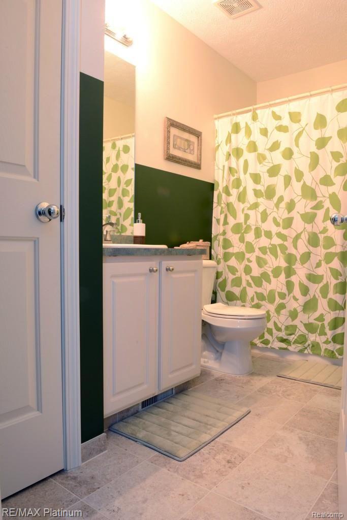 857 Dewars Street Howell, MI 48843 - Photo 23 of 26 Full Bath on 2nd floor, new ceramic tile.