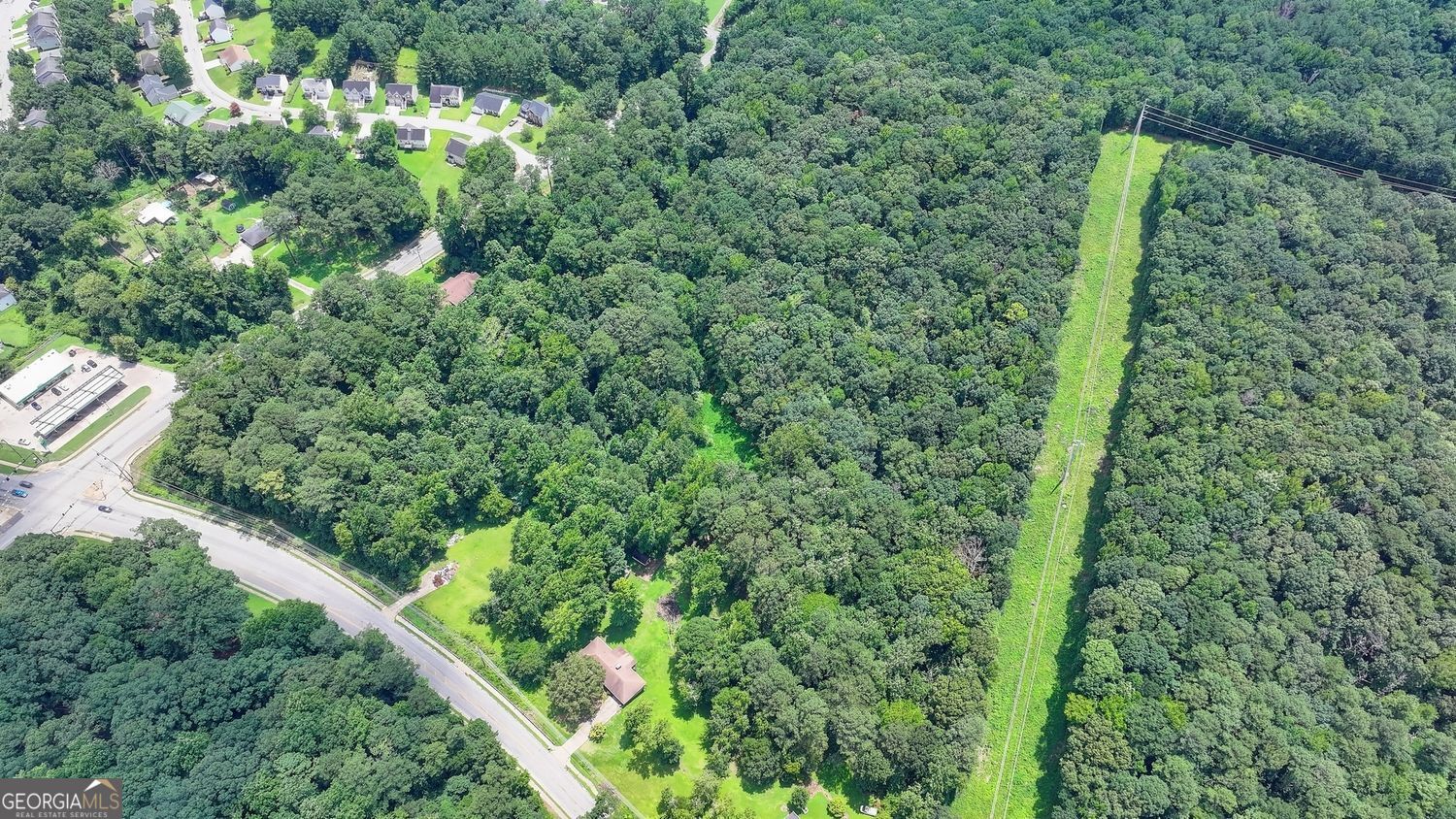 2773 River Road Ellenwood, GA 30294 - Photo 13 of 19 a view of a forest with a street