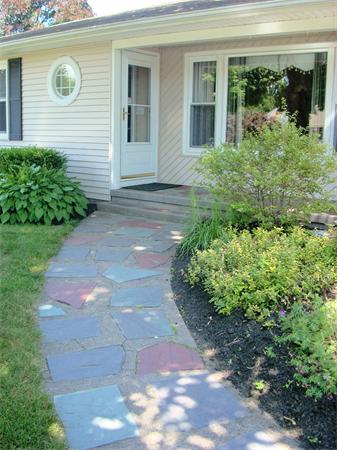 742 Amostown Road West Springfield, MA 01089 - Photo 3 of 21 a view of entrance of house and yard with green space