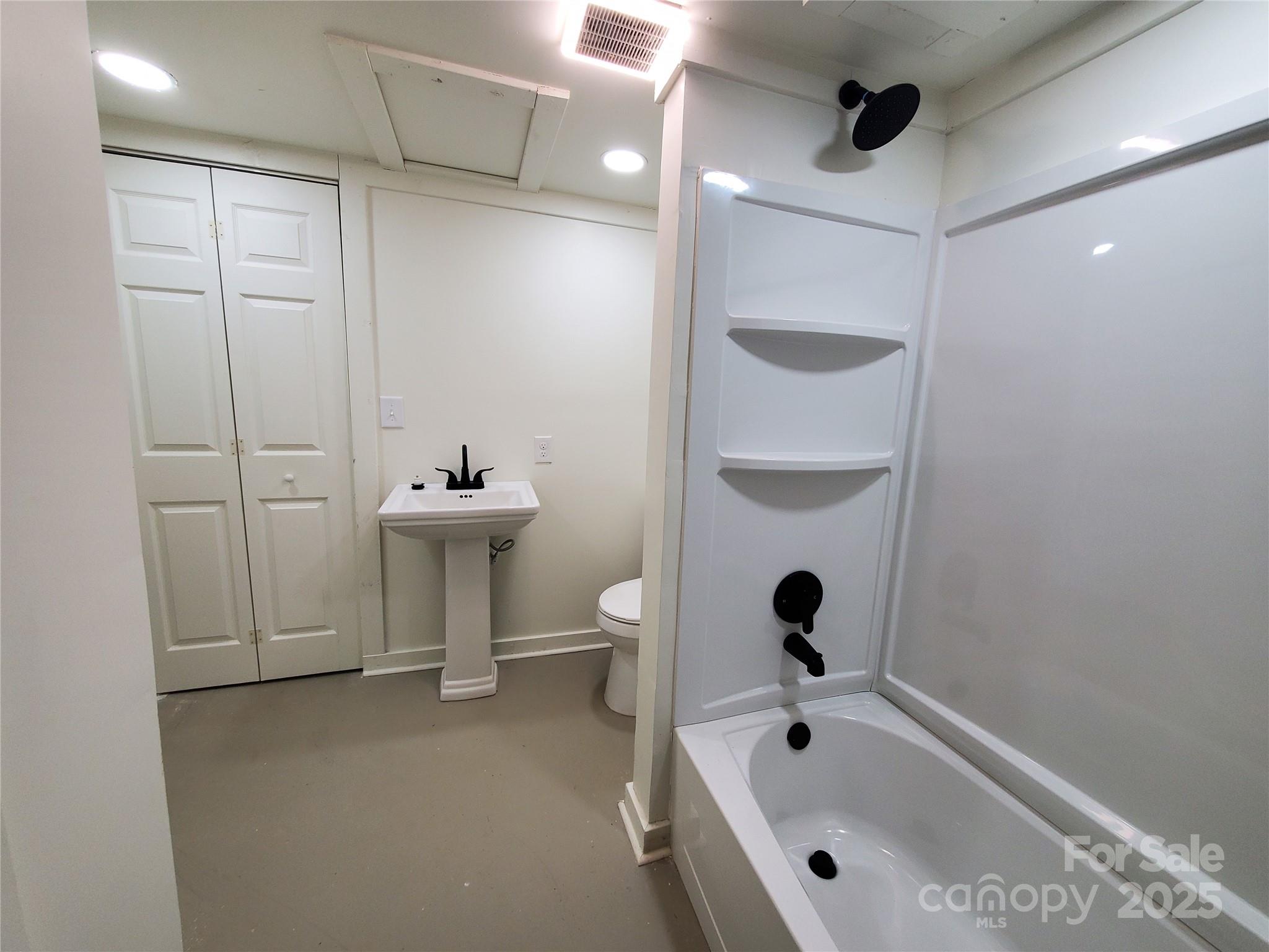 2129 Rankin Road Gastonia, NC 28056 - Photo 12 of 15 a bathroom with a bathtub and shower