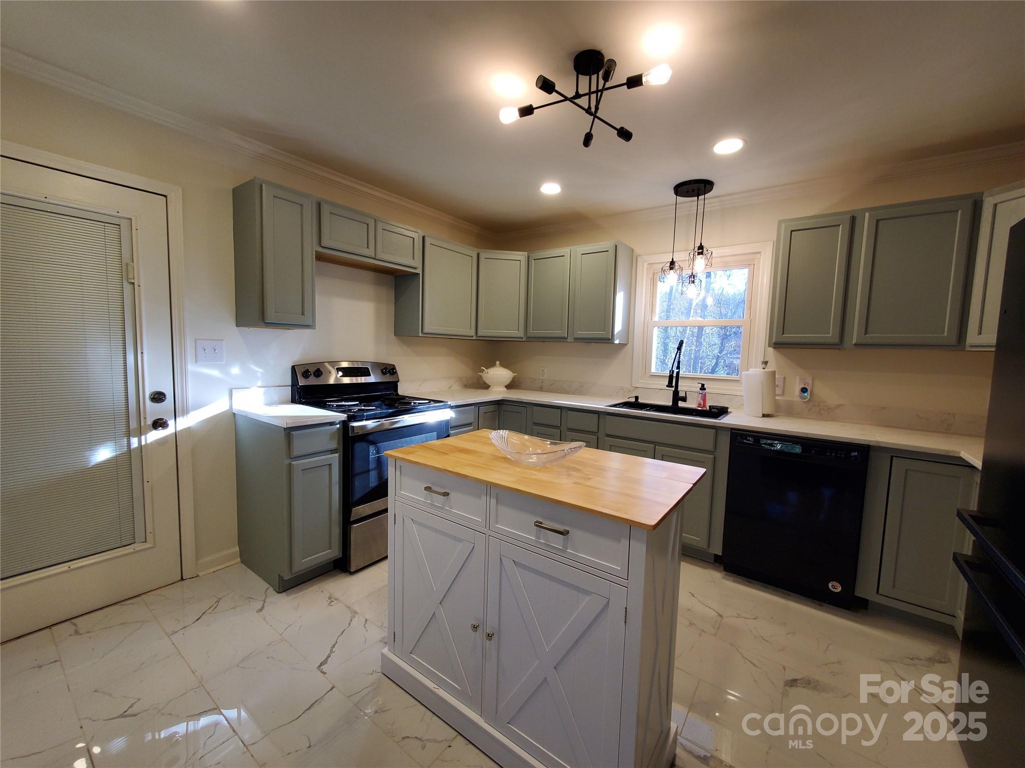 2129 Rankin Road Gastonia, NC 28056 - Photo 5 of 15 a kitchen with a sink dishwasher a stove a refrigerator and cabinets