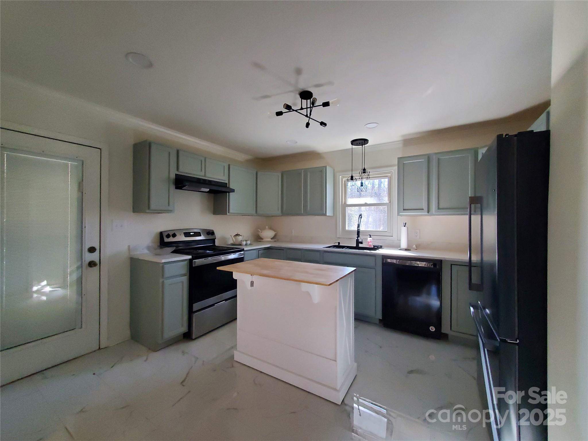 2129 Rankin Road Gastonia, NC 28056 - Photo 6 of 15 a kitchen with a sink stove and refrigerator