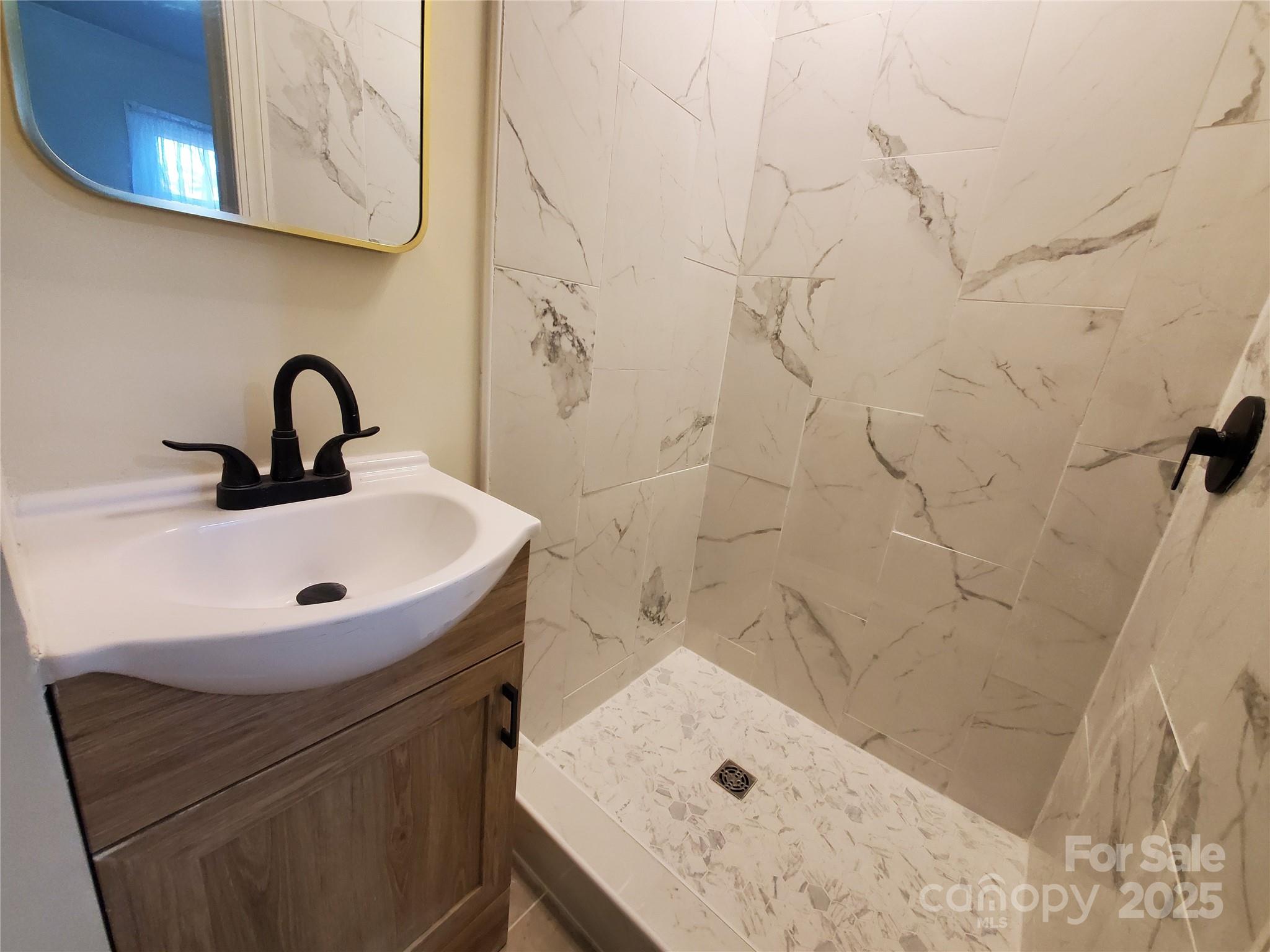 2129 Rankin Road Gastonia, NC 28056 - Photo 10 of 15 a bathroom with a sink and vanity