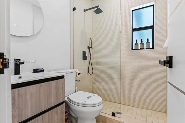 a bathroom with a sink a mirror and vanity