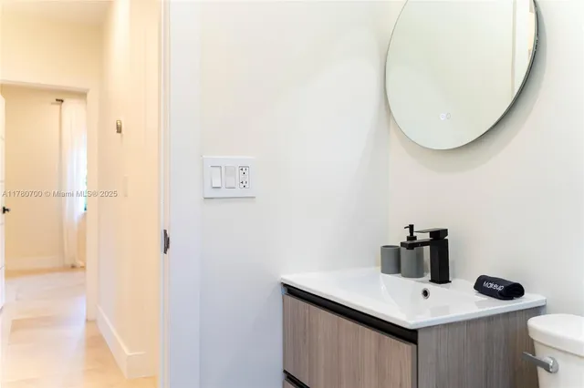 a view of washer and dryer with kitchen in the background
