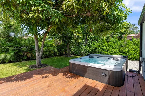 a wooden bench sitting in backyard of a house