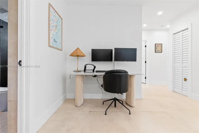 a workspace with furniture and mirror