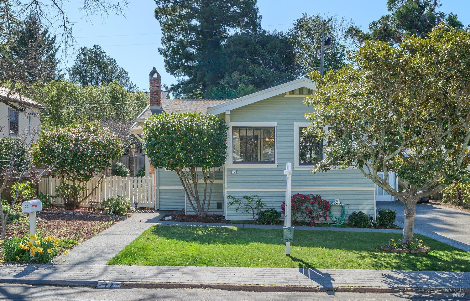 77 Suffield Avenue San Anselmo, CA 94960 - Photo 1 of 1 a view of a white house with a fountain and a large tree