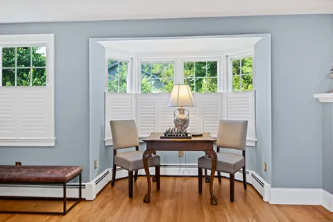 a view of a dining room with furniture window and outside view