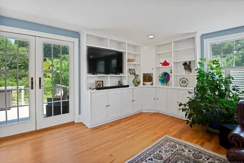a view of a kitchen with furniture and a potted plant