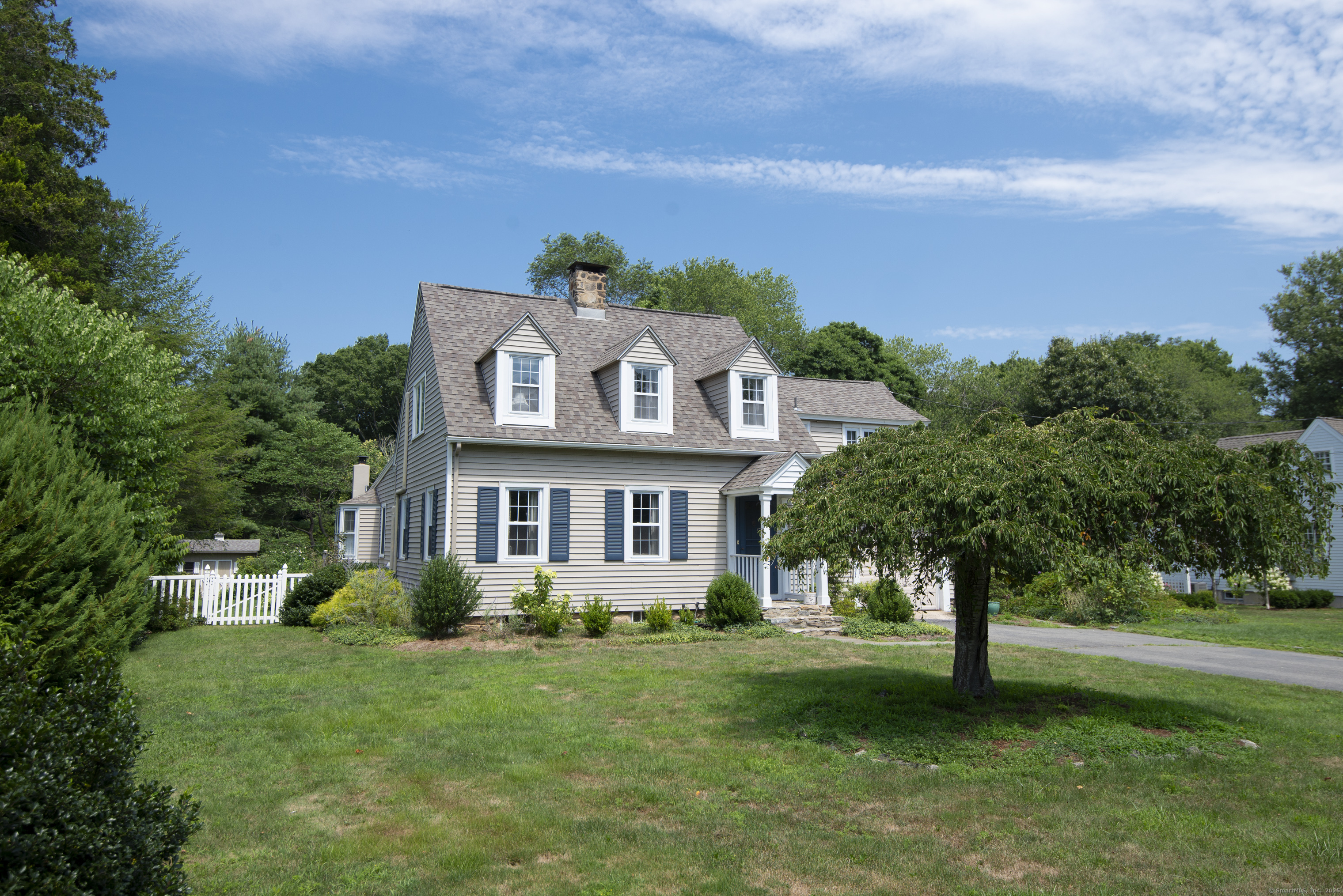 13 Maple Avenue Essex, CT 06426 - Photo 2 of 31 a front view of a house with a garden