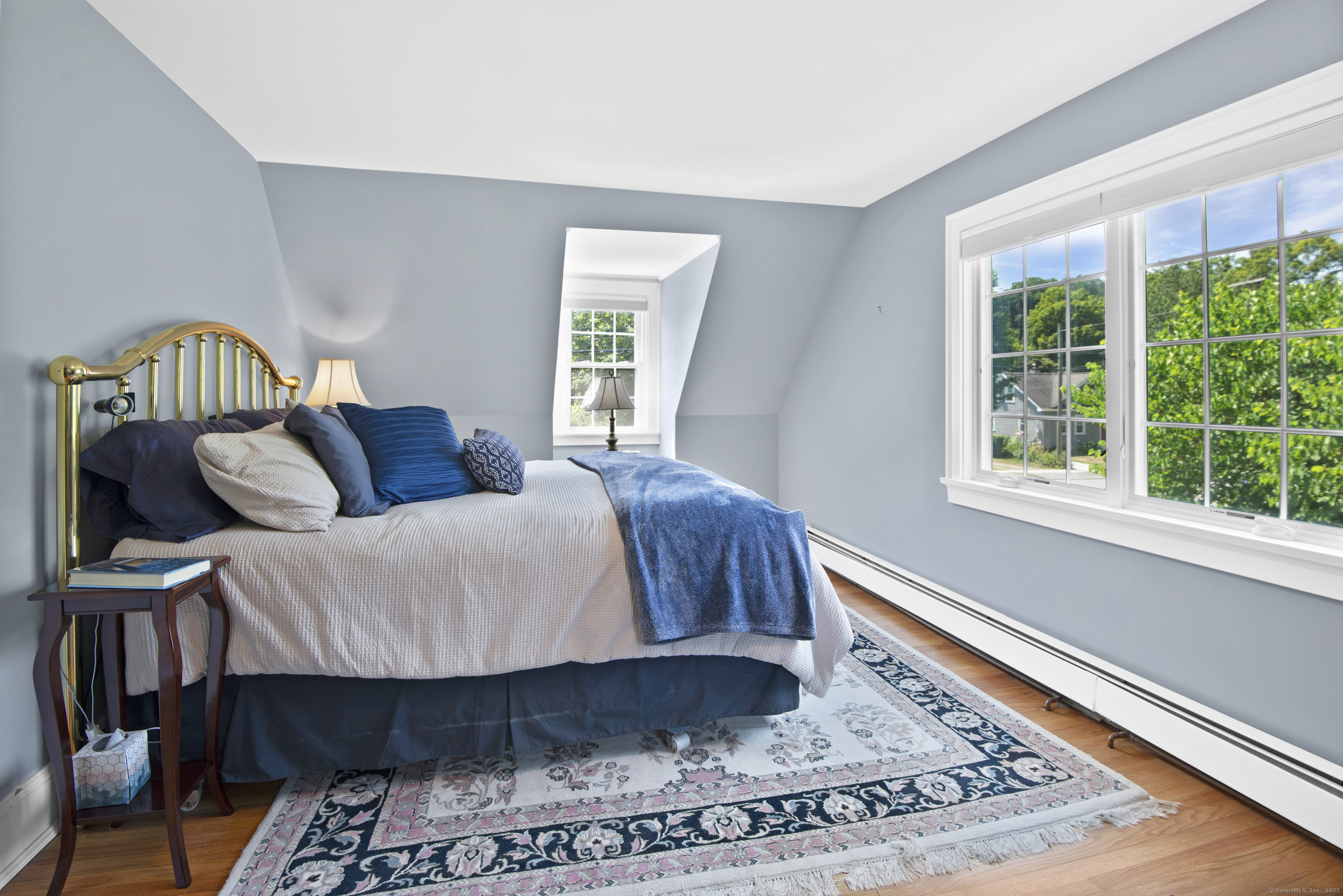13 Maple Avenue Essex, CT 06426 - Photo 22 of 31 a bedroom with a bed a window and potted plant