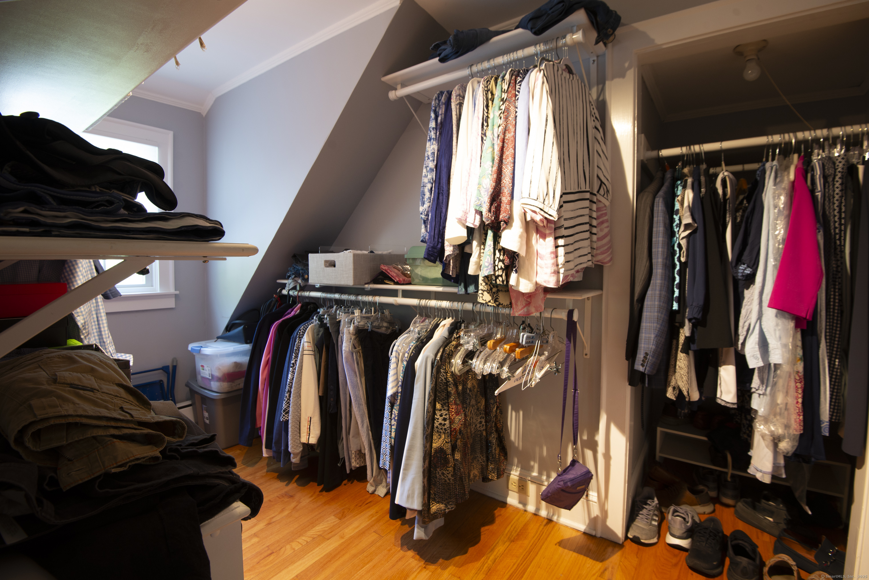 13 Maple Avenue Essex, CT 06426 - Photo 24 of 31 a view of walk in closet with clothes and shoes