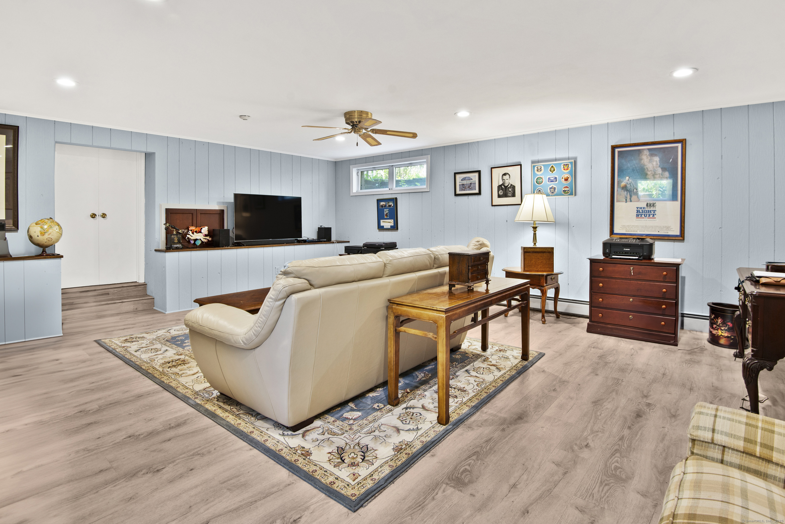13 Maple Avenue Essex, CT 06426 - Photo 28 of 31 a living room with furniture and a flat screen tv