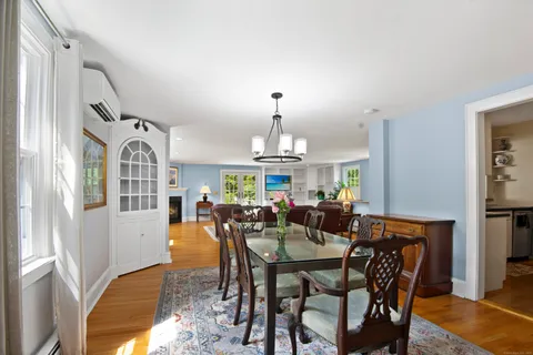 a view of a dining room with furniture window and wooden floor