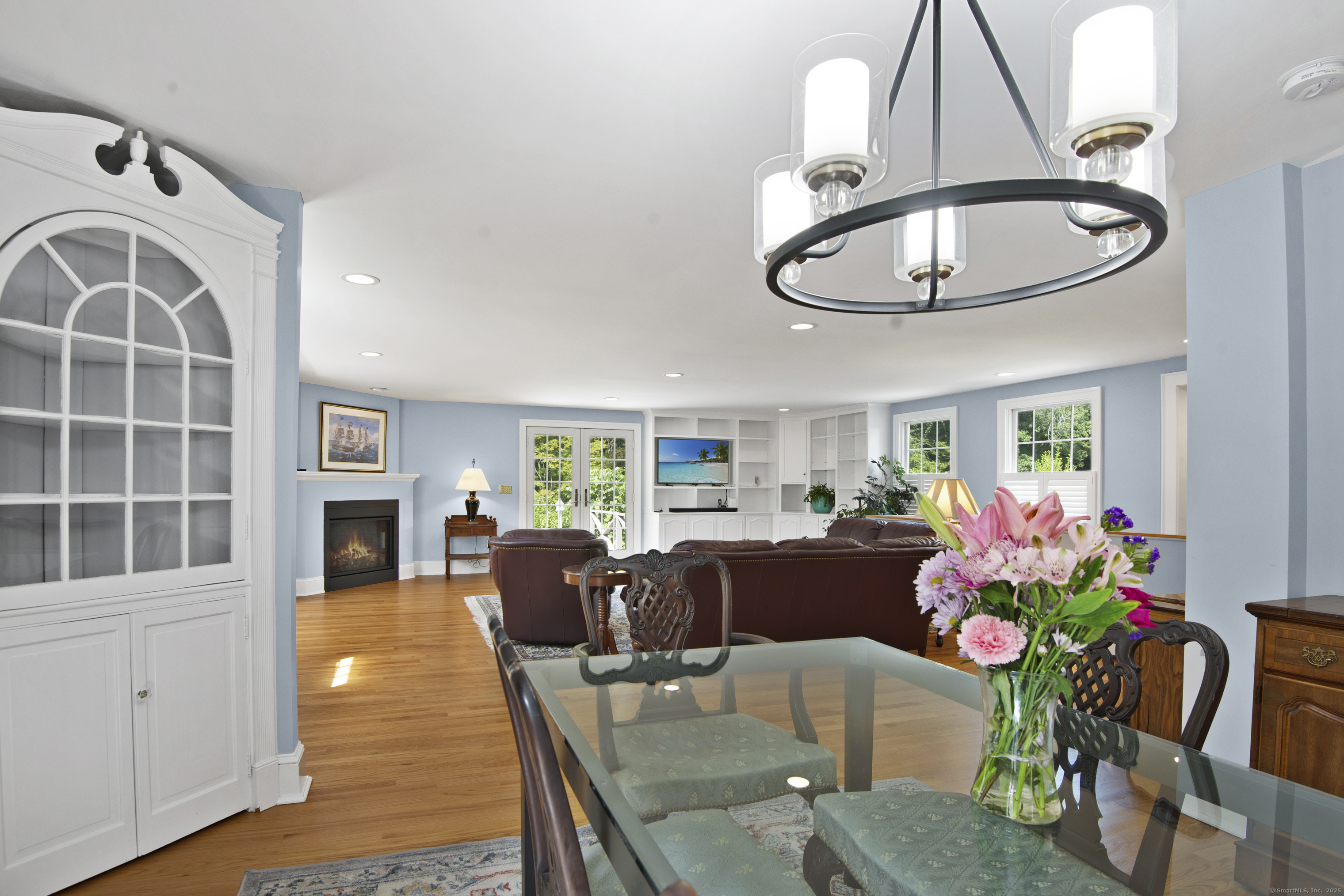 13 Maple Avenue Essex, CT 06426 - Photo 8 of 31 a living room with furniture a dining table and a fireplace