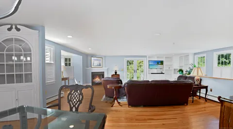 a living room with furniture window and wooden floor