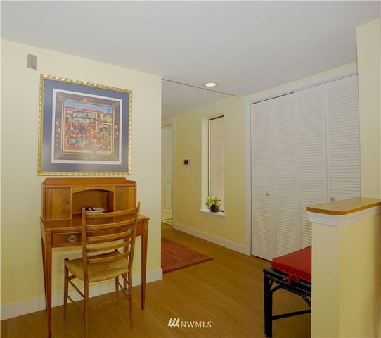 a view of a hallway with seating area