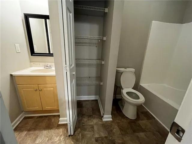 a bathroom with a toilet and a sink