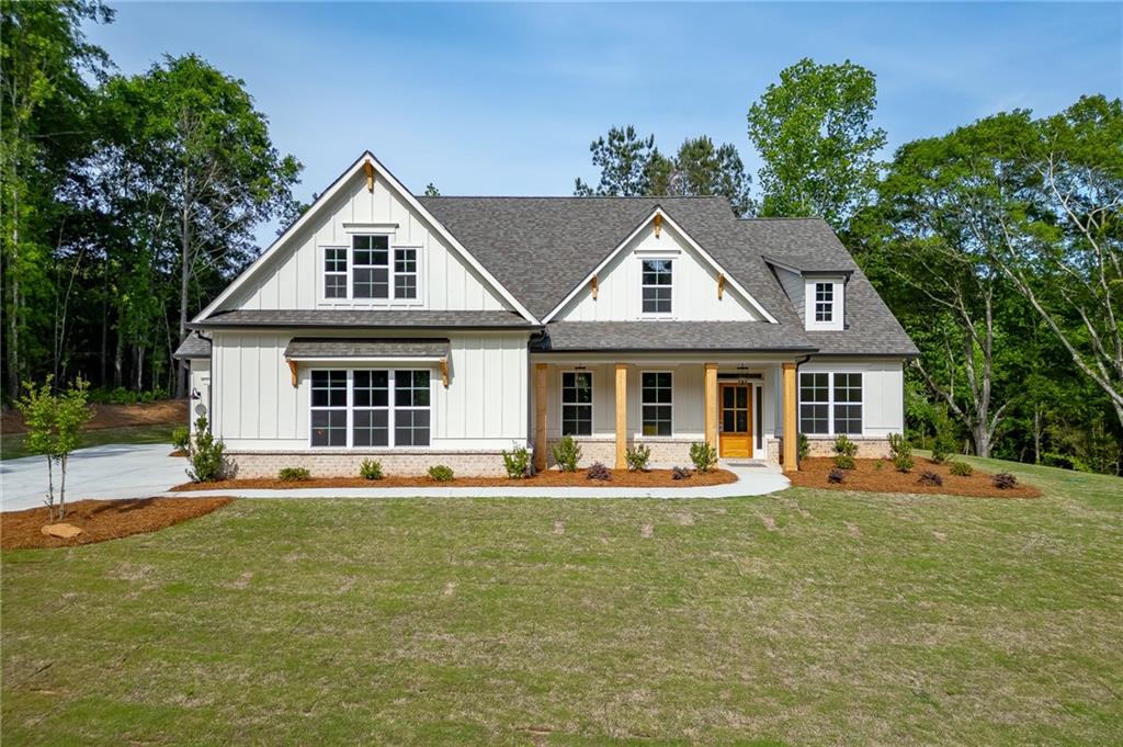 1210 Austin Road Winder, GA 30680 - Photo 2 of 56 a front view of a house with a yard
