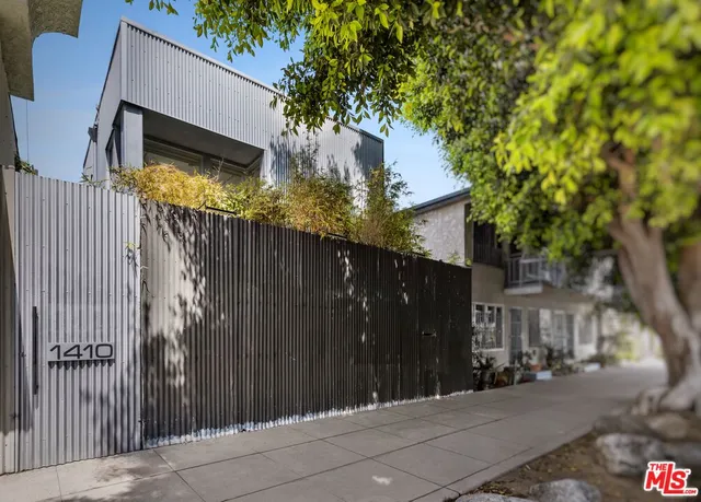 a view of a house with a tree