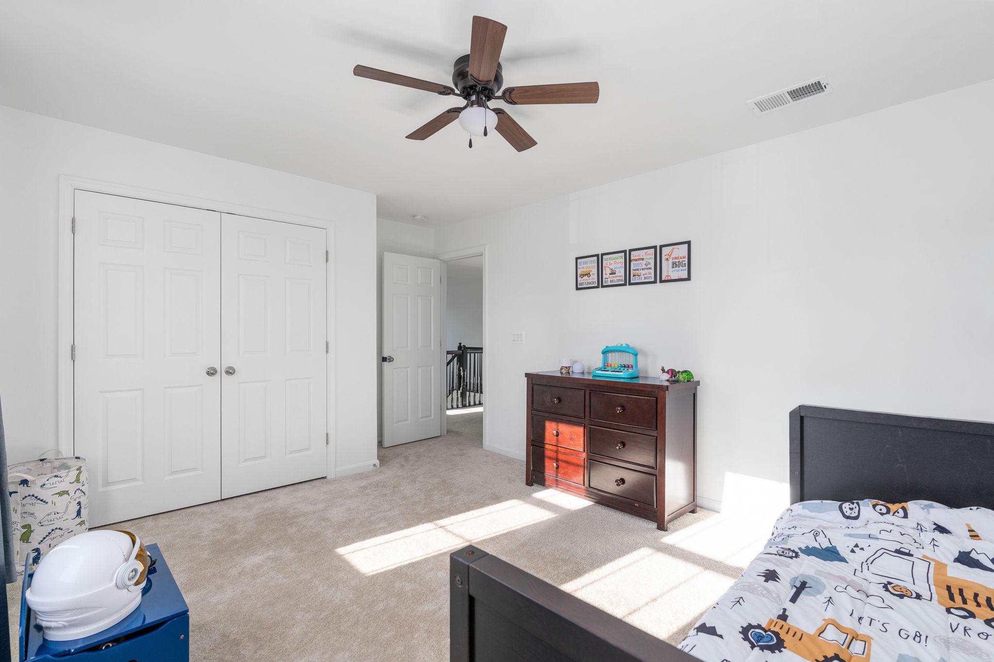 6371 Pointer Lane King George, VA 22485 - Photo 17 of 38 a bedroom with a bed and a dresser in it