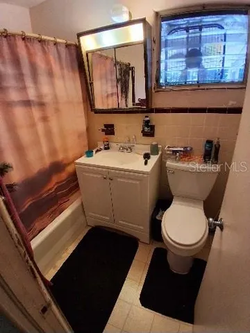 a bathroom with a toilet and a sink