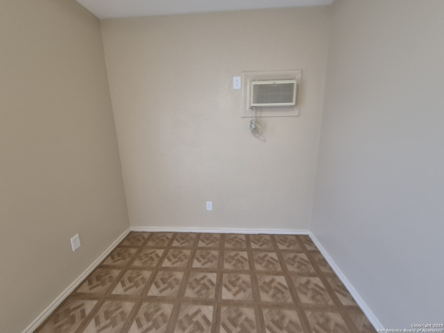 1016 Blanco Road, Unit 203 San Antonio, TX 78212 - Photo 8 of 12 a view of a room with wooden floor and a window