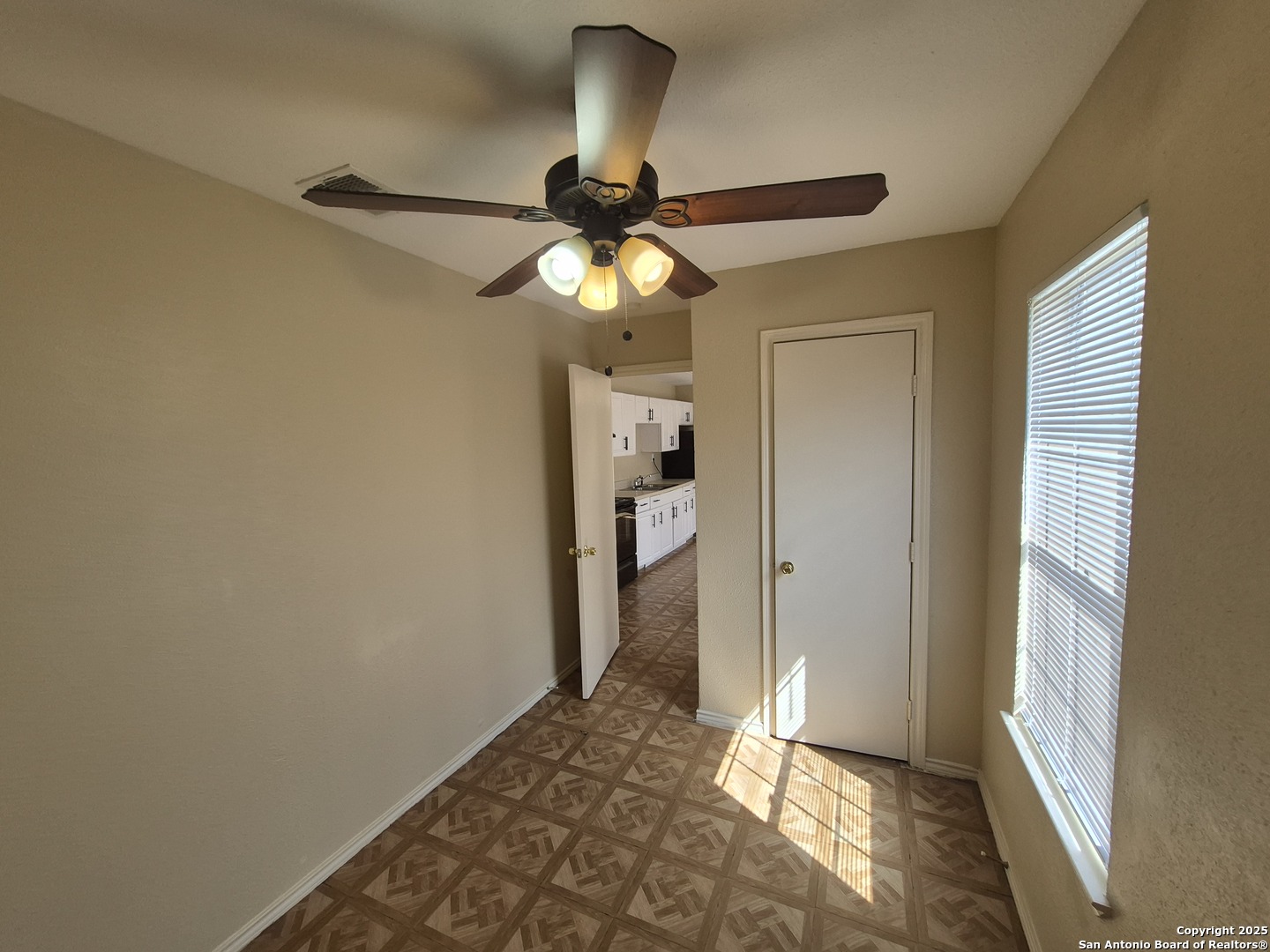 1016 Blanco Road, Unit 203 San Antonio, TX 78212 - Photo 9 of 12 a view of a chandelier fan and wooden floor
