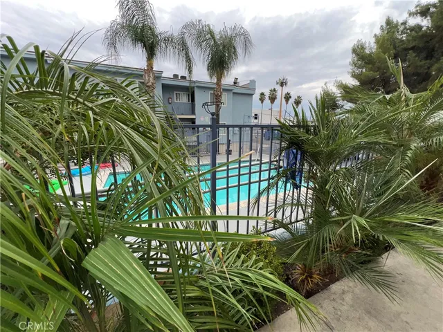 a view of a patio with swimming pool table and chairs