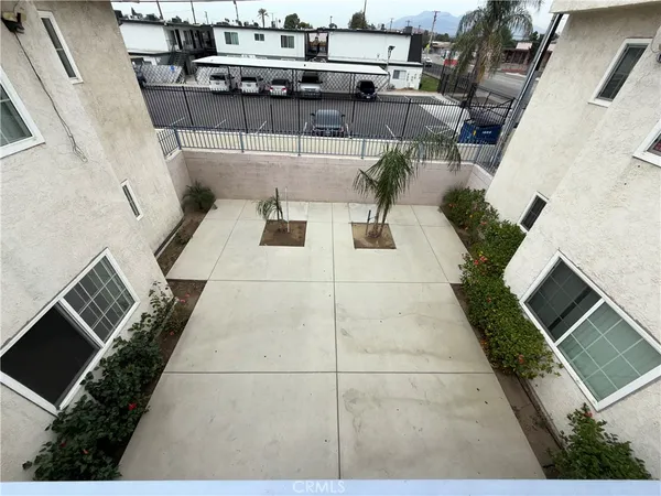 a view of a porch with furniture and a yard