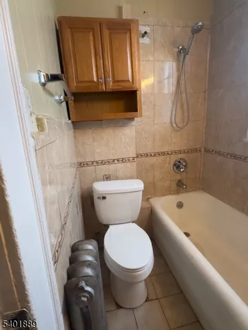 a bathroom with a toilet a sink and bathtub