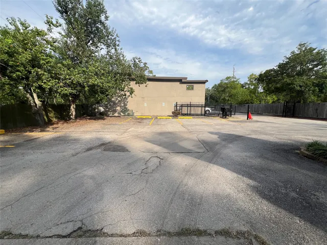 a view of large trees with a big yard