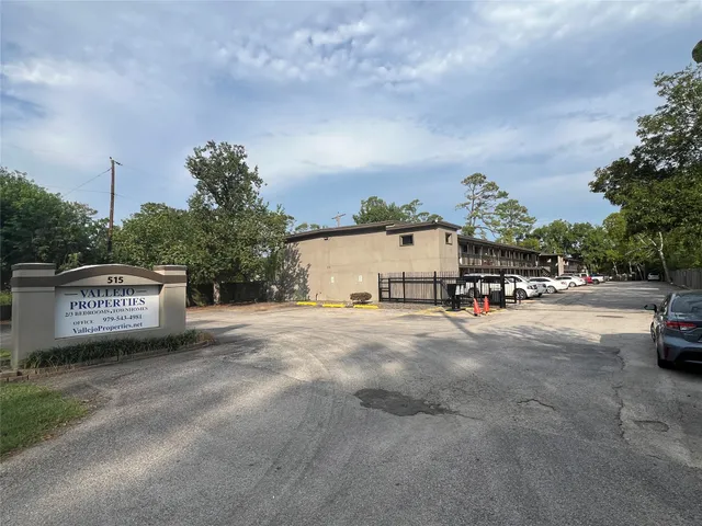 a view of a house with a yard and garage