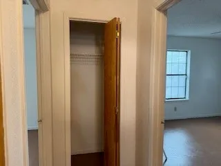 a view of walk in closet with window