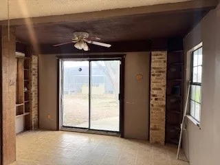 a view of a hallway with windows