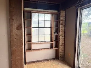 a bathroom with a bathtub and window