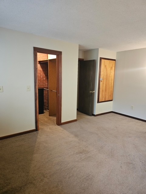 114 Houston Street Clemson, SC 29631 - Photo 8 of 19 Neutral walls and classic wood trim frame this versatile bedroom featuring a walk-in closet.