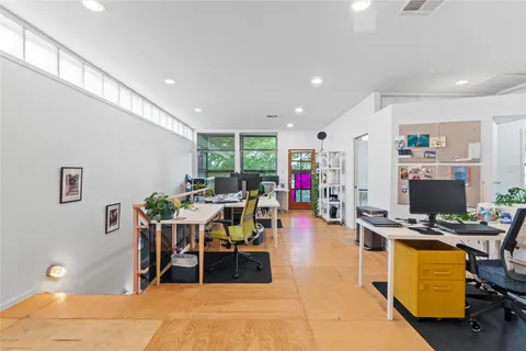 a view of a workspace with furniture