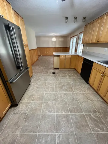 a view of a livingroom with furniture and staircase