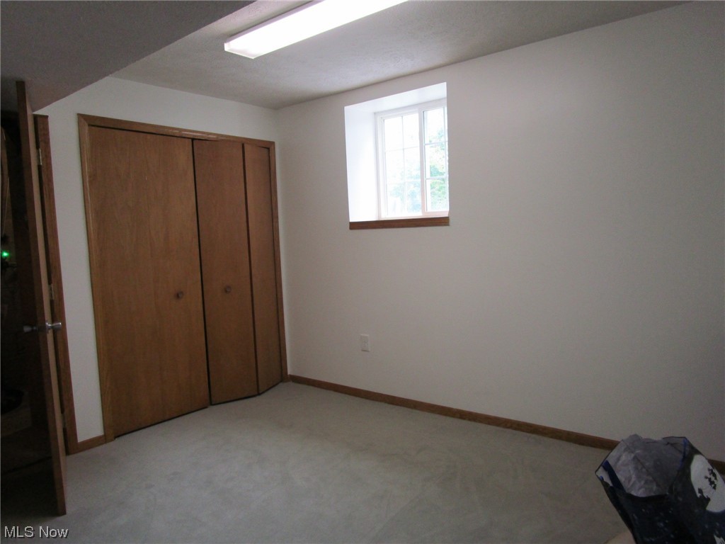14140 Radcliffe Road Painesville, OH 44077 - Photo 32 of 34 Basement bedroom with closet and daylight windows!