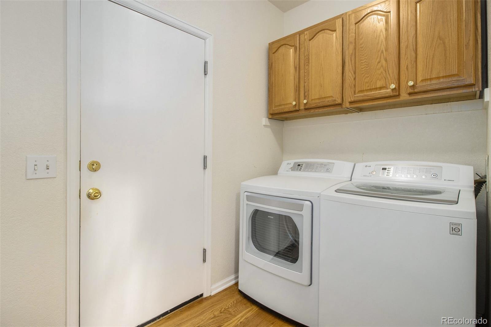 1082 Riddlewood Road Highlands Ranch, CO 80129 - Photo 13 of 28 a utility room with dryer and washer