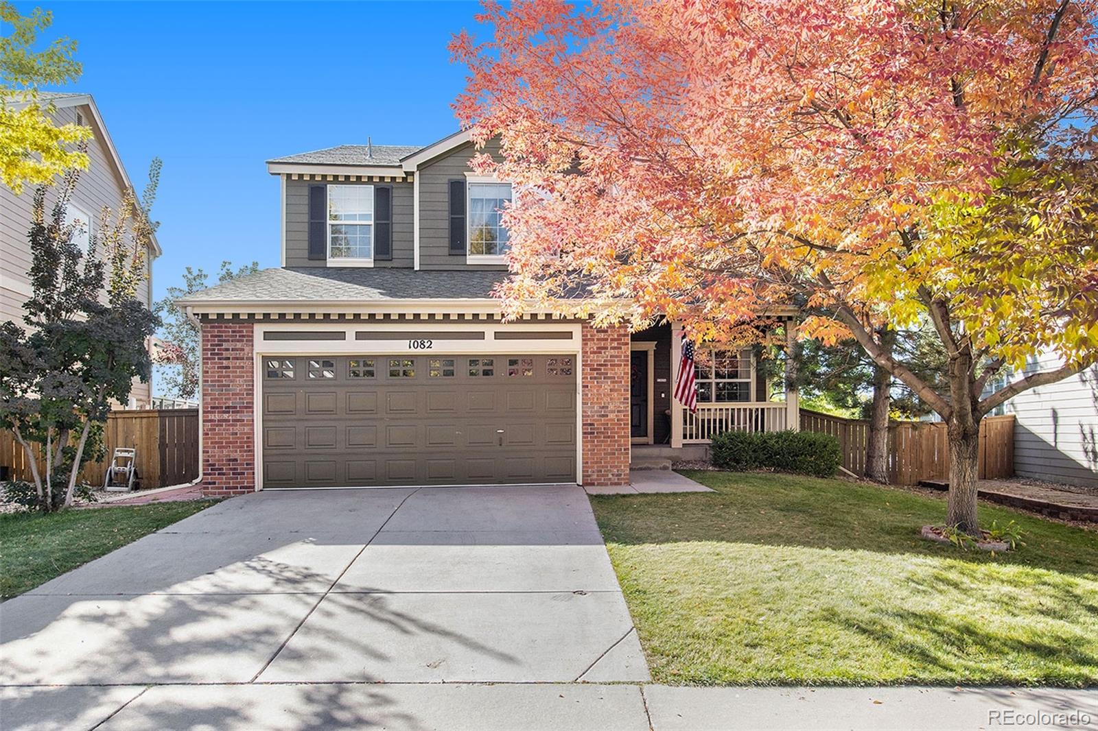 1082 Riddlewood Road Highlands Ranch, CO 80129 - Photo 2 of 28 a view of a house with a yard